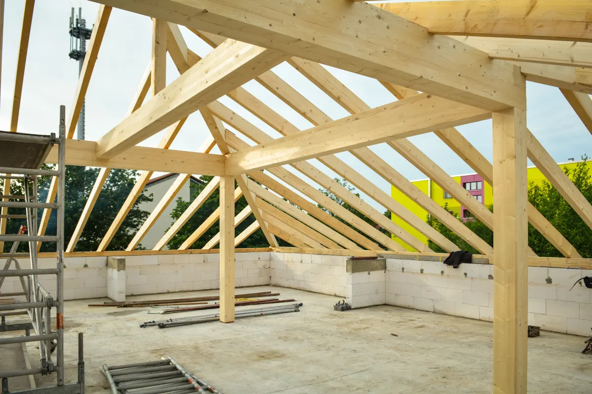 Wooden roof framing in progress on a new building