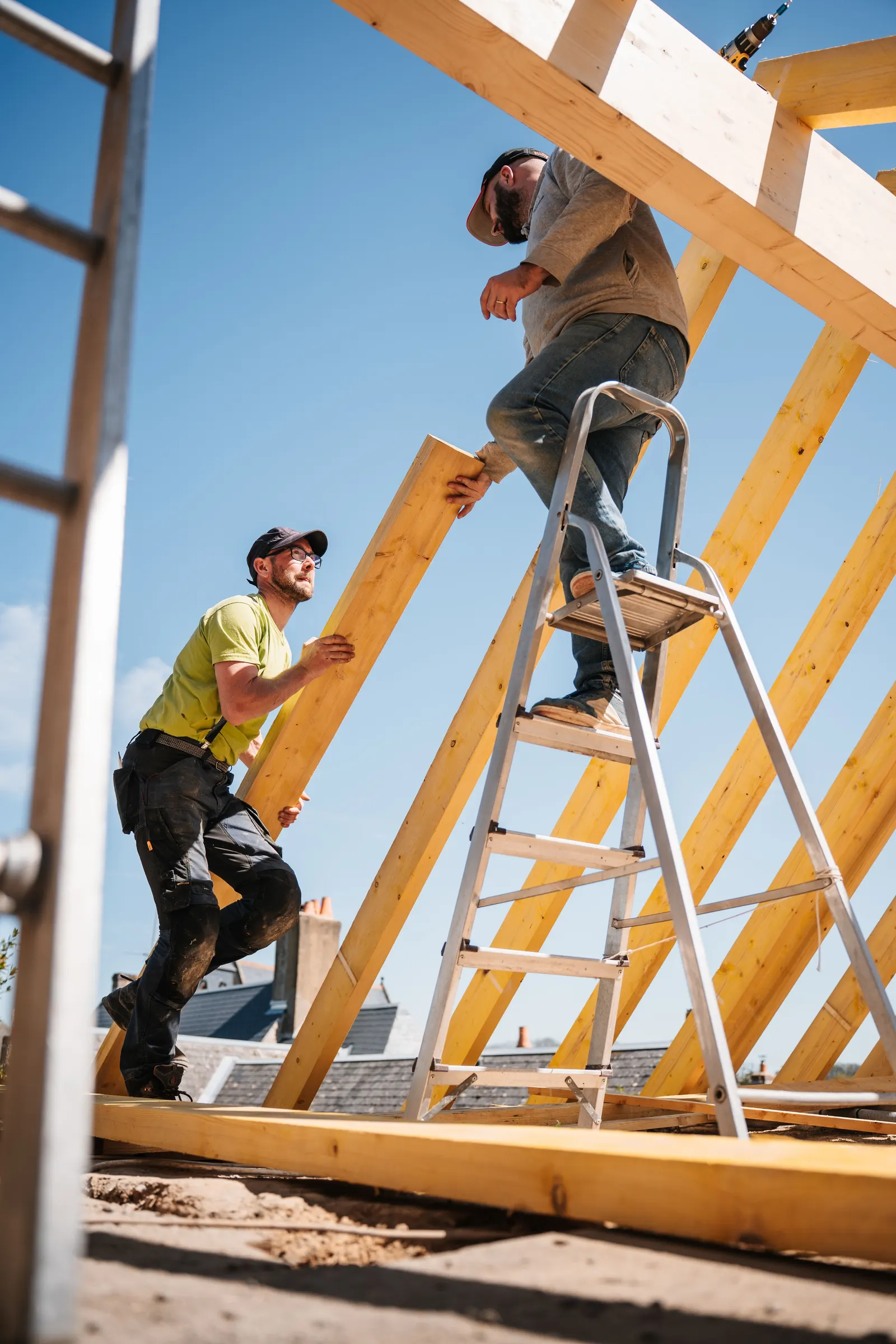 Crew building a wooden roof structure