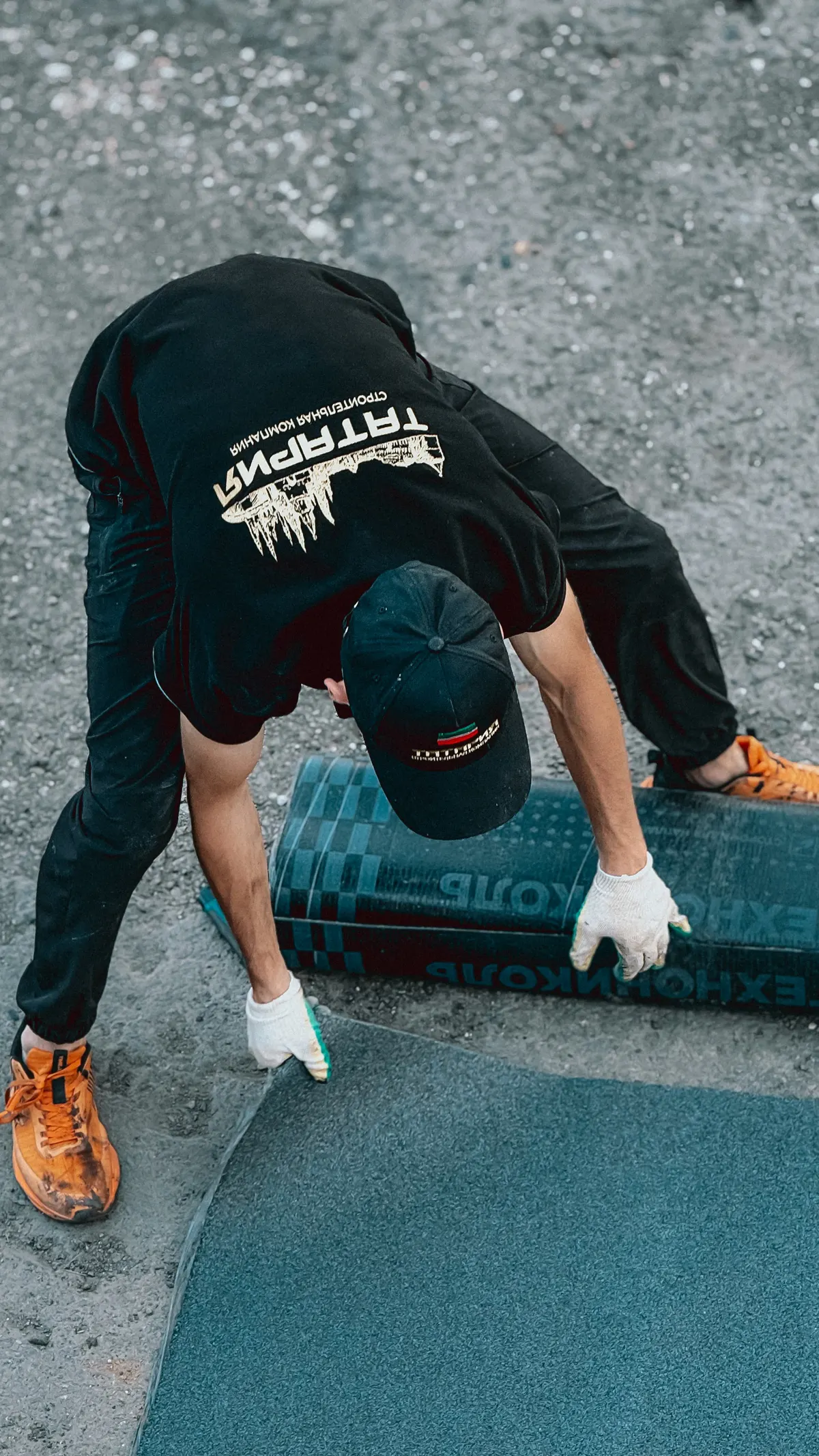 Roofing craftsman installing material with precision