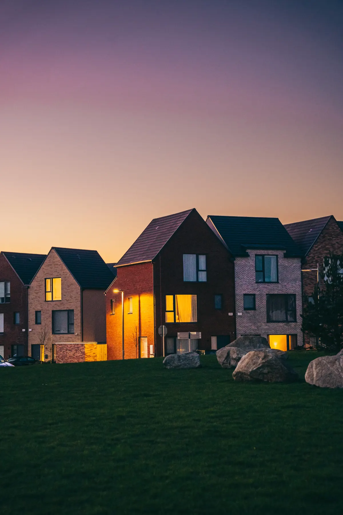 Modern suburban homes under a twilight sky